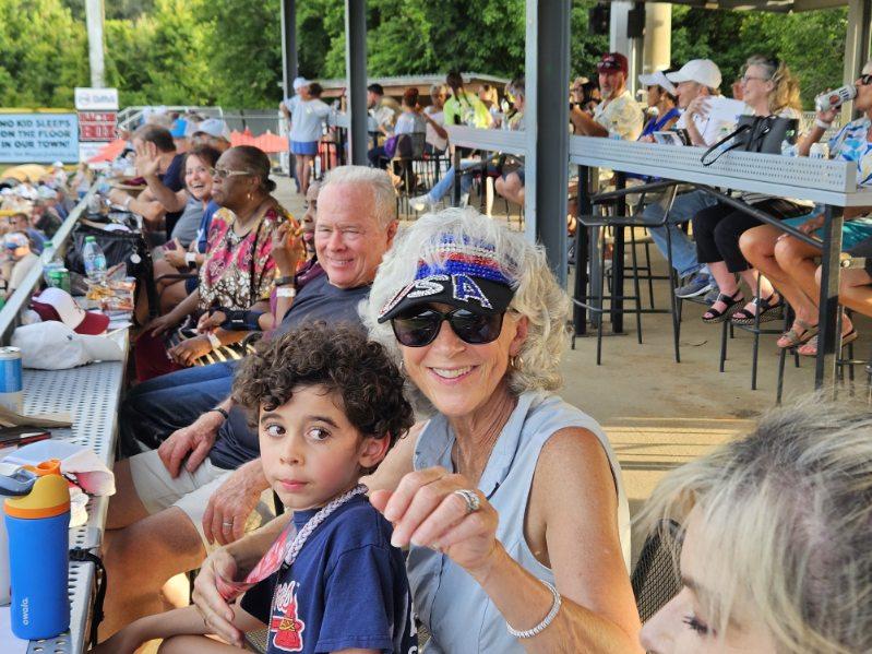 Guests watch the Macon Bacon game from the covered group seating area at Luther Williams Field.